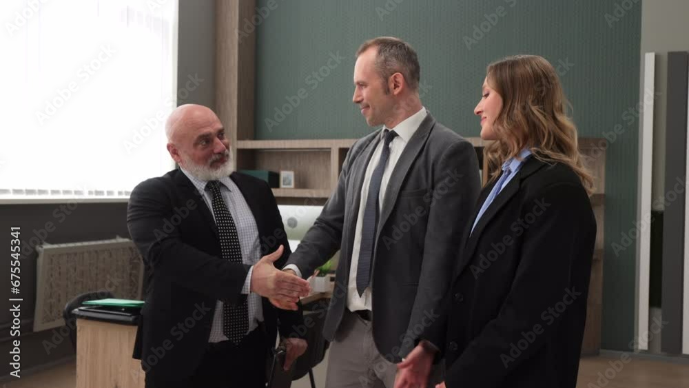 Business partners in company office building shaking hands after successful signing contract. Sign contract agreement paper. Happy diverse business people office workers lawyers investors. 4k