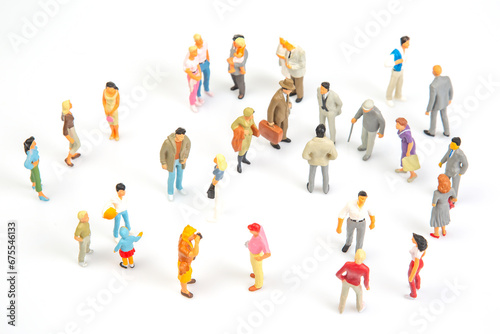 miniature people. group of different people communicate with each other on a white background. concept of communications and relations in society.