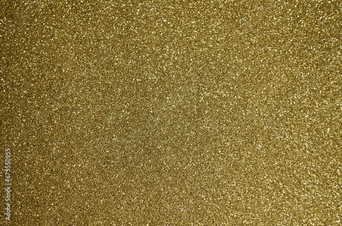 Fondo de brillos / textura glitter de color dorado/oro claro. Se puede usar como fondo de celebración, año nuevo o navidad. photo