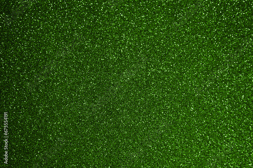 Fondo de brillos / textura glitter de color verde claro. Se puede usar como fondo de celebración, año nuevo o navidad.