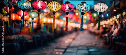 At the night market during the Chinese New Year celebration in China vibrant hues of green blue orange red and pink illuminated the surroundings with hanging lamps and art showcasing the be