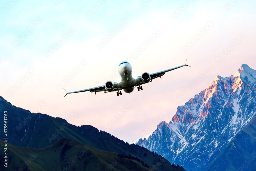 passenger plane flies over the mountains. air transport industry passenger plane flies over the mountains. air transport industry