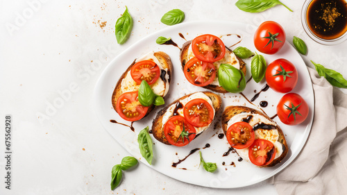 bruschetta with tomato, basil and cheese on a marble background. healthy snack