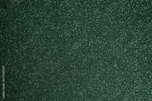 Fondo de brillos / textura glitter de color verde oscuro. Se puede usar como fondo de año nuevo o navidad. photo