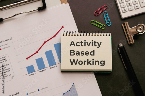 There is notebook with the word Activity Based Working. It is as an eye-catching image.