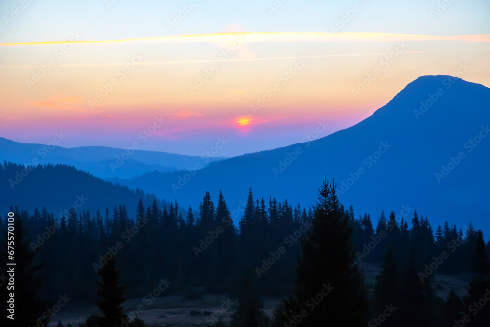 bright sunny dawn on the mountain slopes