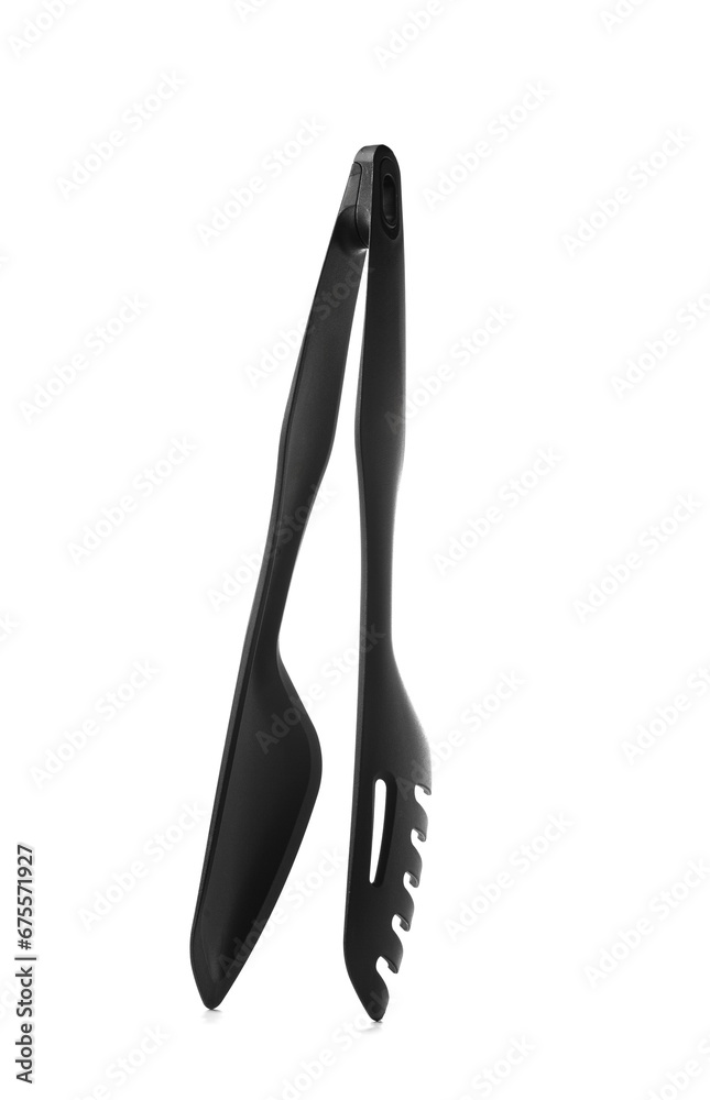 Black kitchen tongs, isolated on a white background. Black kitchen tongs, isolated on a white background.