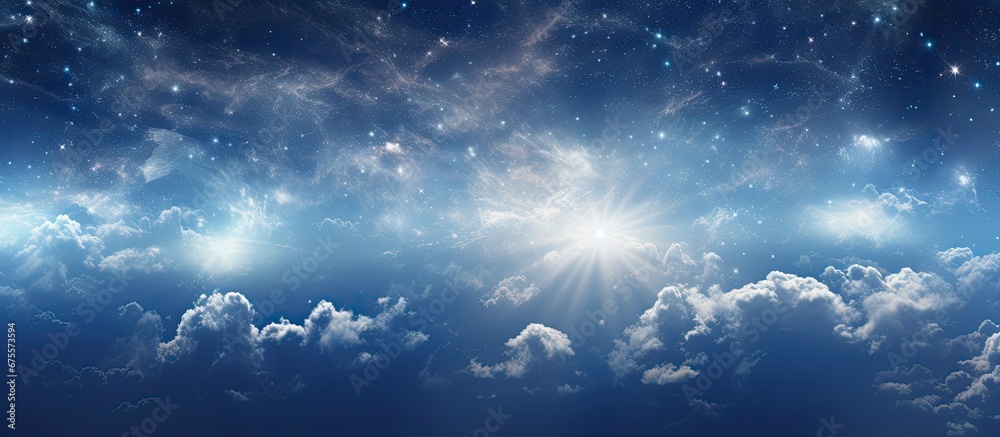 In the abstract background of the sky the mesmerizing nature of light intertwines with the vastness of space amongst the fluffy clouds adorned by the radiant sun giving life to a celestial 