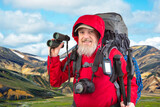 happy bearded man traveler with hiking equipment on mountain landscape background. nature hikes in the mountains