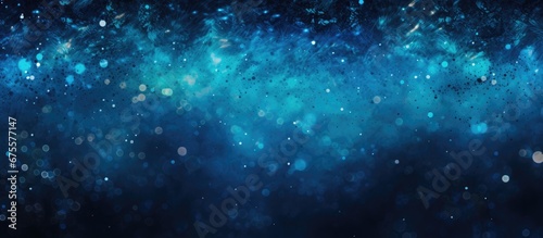 The abstract black and blue background texture resembles the mesmerizing underwater world with shimmering bubbles sparkling light and peaceful sea creatures creating a perfect wallpaper for photo