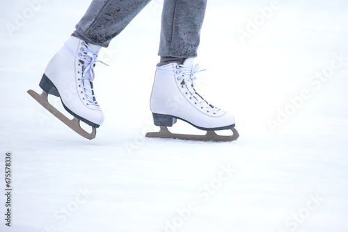 legs of a skater on an ice rink. hobbies and winter sports