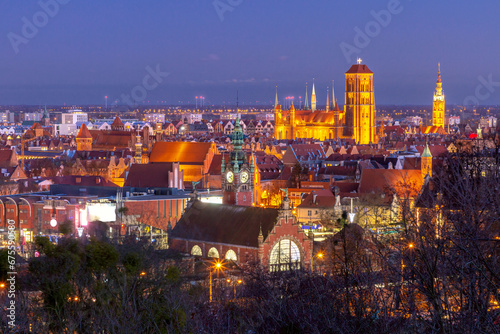 Aerial view of the Saint Mary Church and City Hall at night in Gdansk, Poland © Kavalenkava