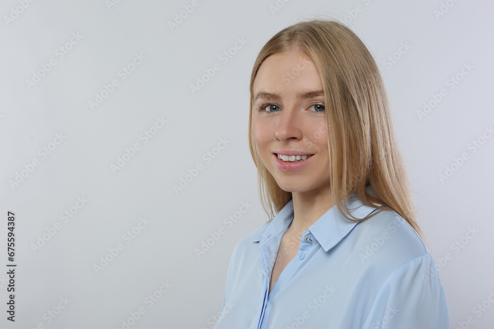 Portrait of beautiful young woman in stylish blouse on white background. Space for text Portrait of beautiful young woman in stylish blouse on white background. Space for text