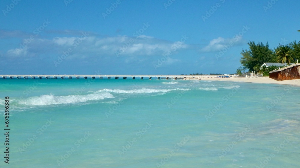 Waves of  clear turquoise water on a secluded beach on North Bimini, Bahamas