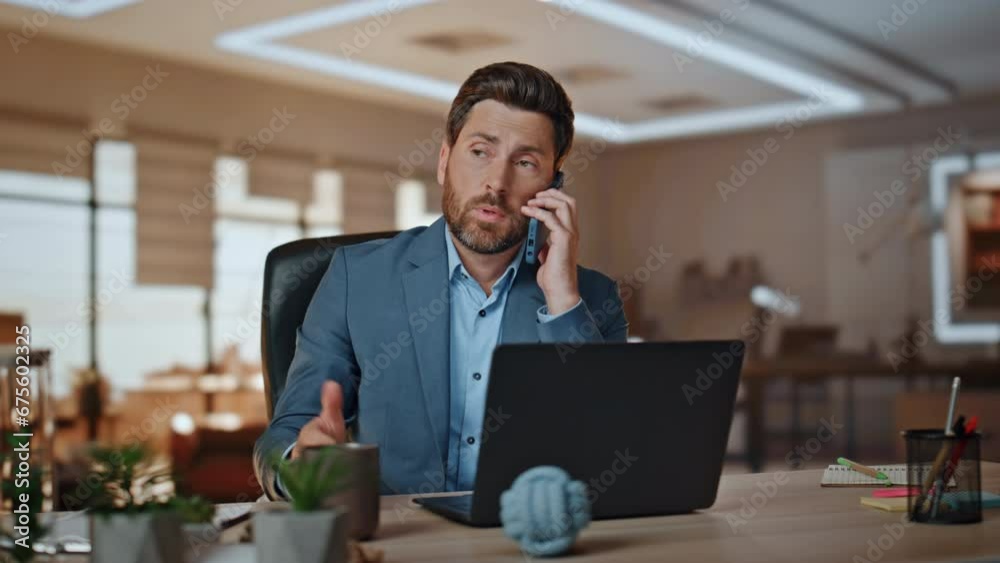 Office worker calling smartphone discussing at light cabinet. Business man call