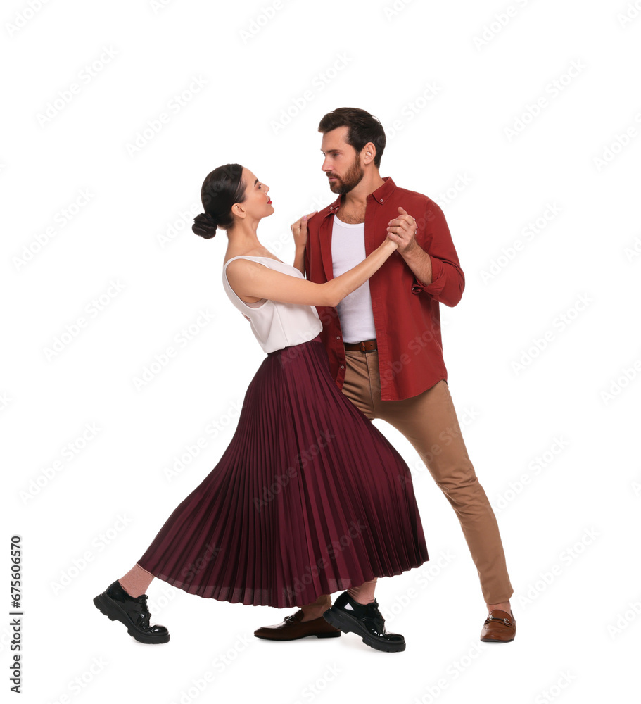 Beautiful couple dancing together on white background