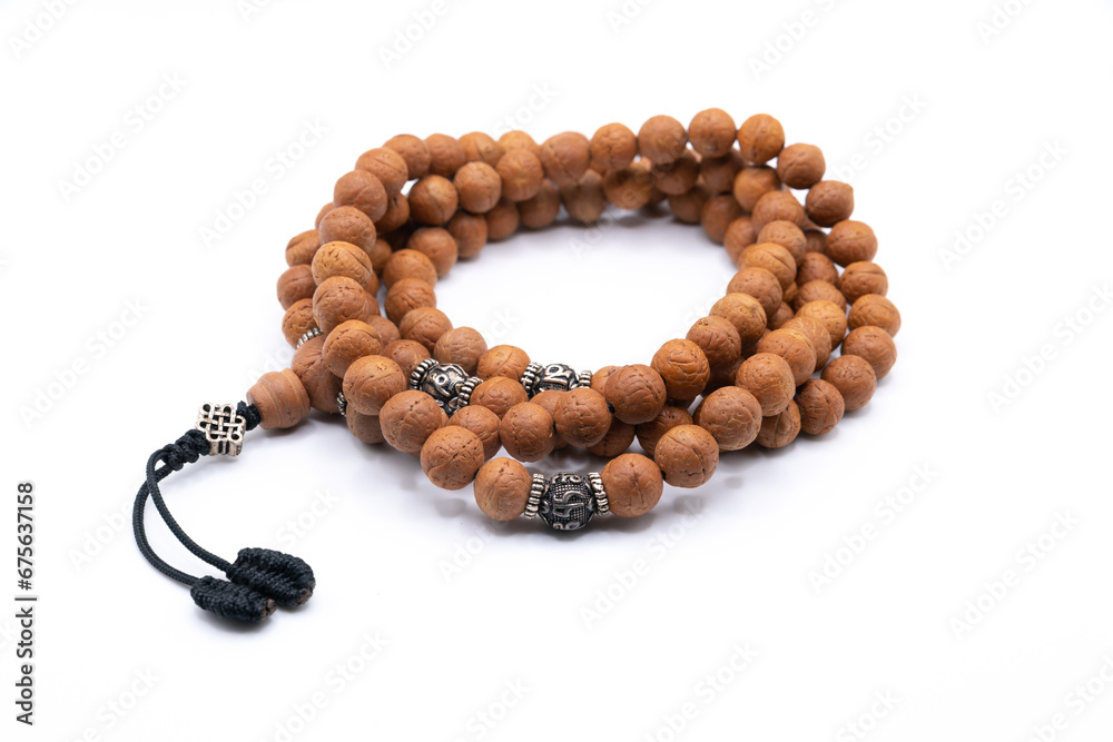 Japa Mala - Buddhist, Tibetan or Hindu wooden prayer beads isolated on white background Japa Mala - Buddhist, Tibetan or Hindu wooden prayer beads isolated on white background