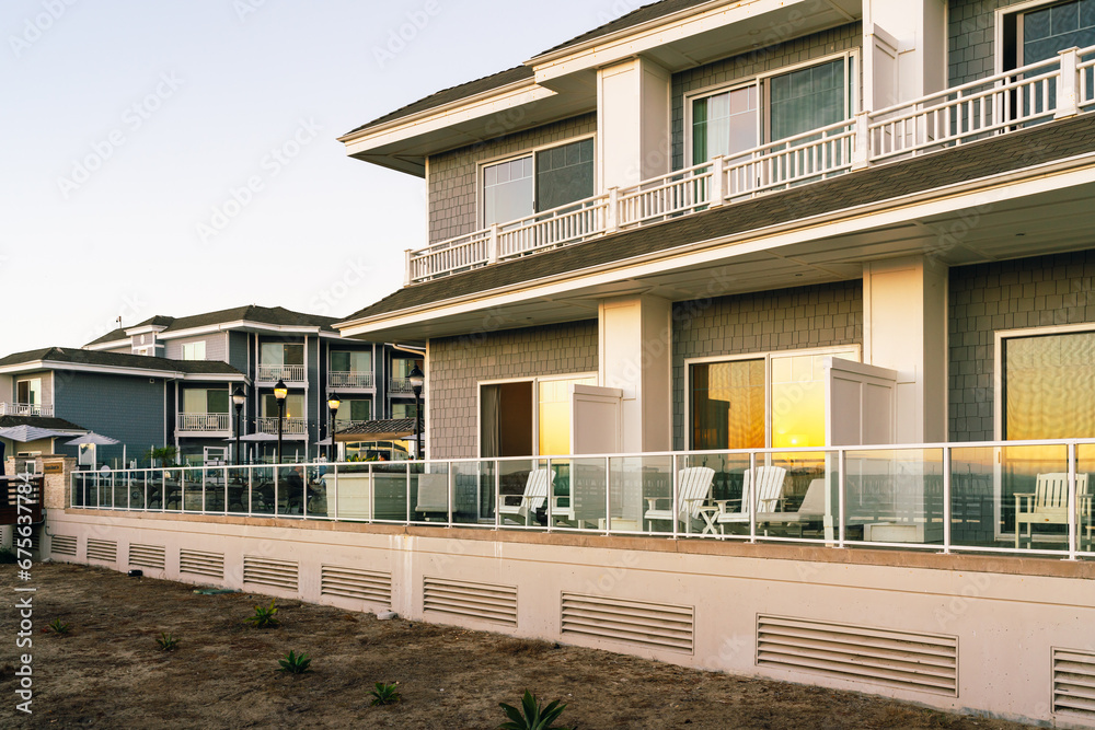 A beachfront hotel with balconies overlooking the ocean at sunset, Pismo Beach, California Central Coast