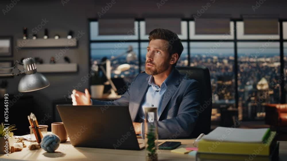 Aggressive guy watching computer at dark room closeup. Angry man gesturing hands Aggressive guy watching computer at dark room closeup. Angry man gesturing hands