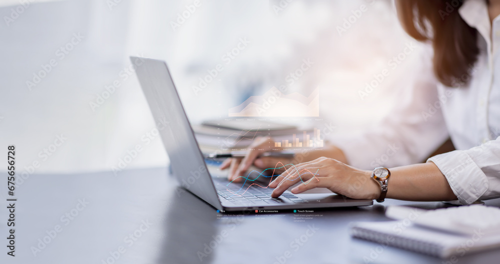 Financial Businesswomen analyze the graph of the company's performance to create profits and growth, Market research reports and income statistics, Financial and Accounting concept. Financial Businesswomen analyze the graph of the company's performance to create profits and growth, Market research reports and income statistics, Financial and Accounting concept.