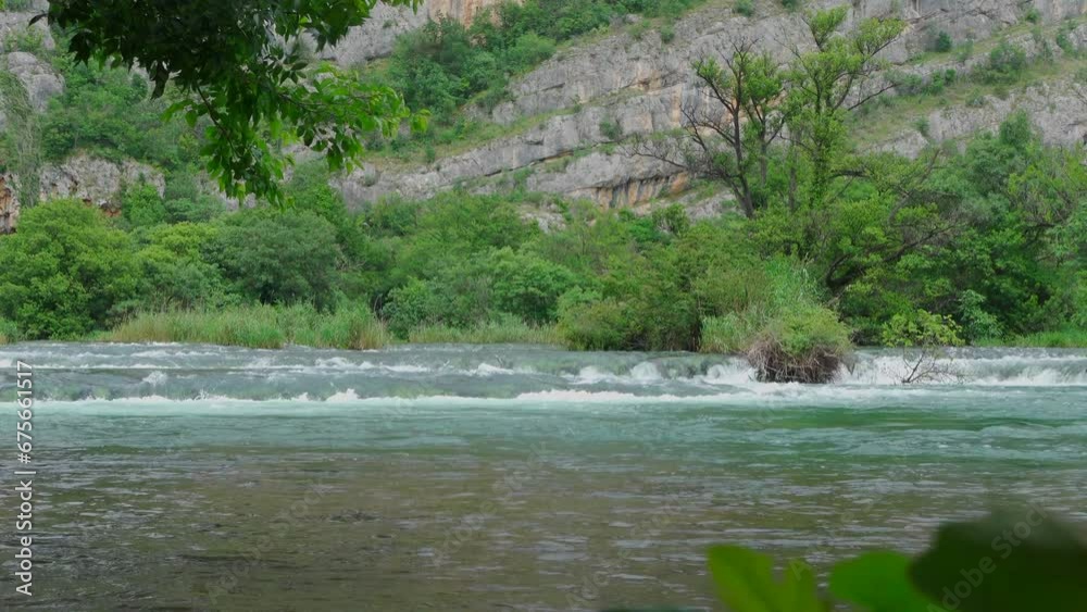 Waterfalls in Krka with Mountain in the background (Croatia) Waterfalls in Krka with Mountain in the background (Croatia)