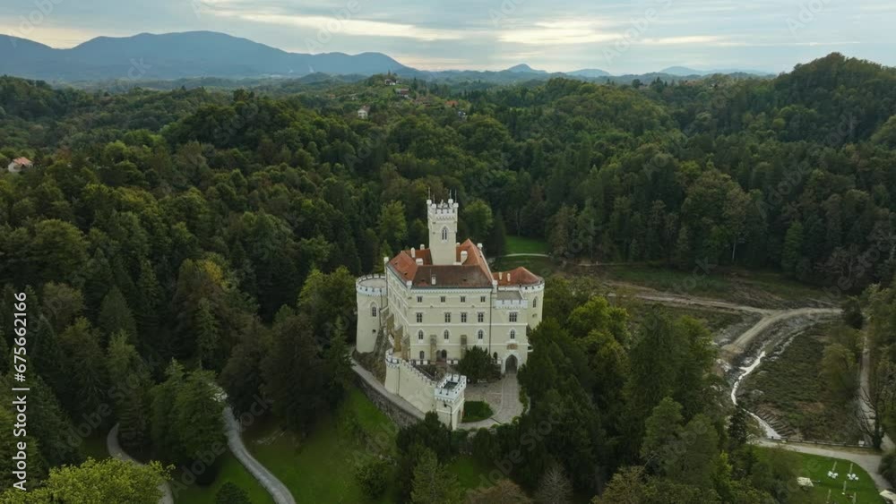 Trakoscan Castle In Scenic Landscape Of Croatia - aerial shot Trakoscan Castle In Scenic Landscape Of Croatia - aerial shot