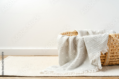 Baby cradle with muslin blanket and wooden toys in a baby room