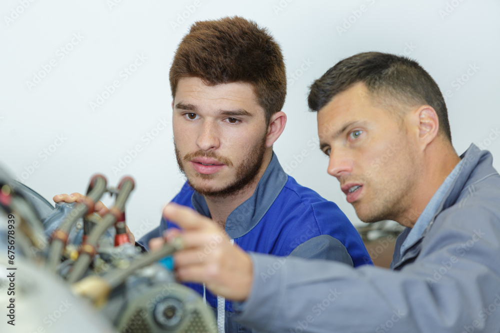 Obraz premium two plumber fixing bathroom water supply