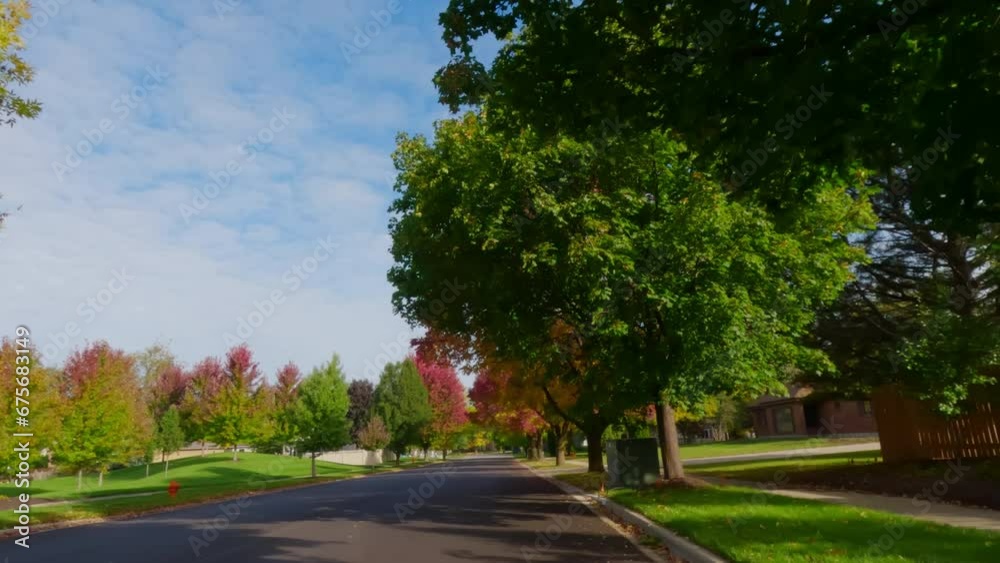 POV shot of suburban street in USA neighborhood on a beautiful Autumn day POV shot of suburban street in USA neighborhood on a beautiful Autumn day