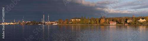 Panorama over the bay Strömmen and the Vasa depth, grey sky back ground and low morning sun light, early autumn morning in Stockholm