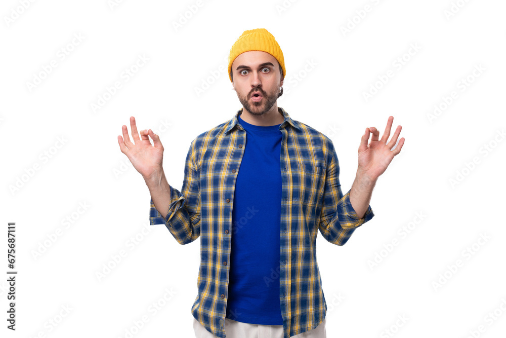 young smart caucasian brunette handsome man with a well-groomed beard and mustache in a plaid shirt on a white background with copy space young smart caucasian brunette handsome man with a well-groomed beard and mustache in a plaid shirt on a white background with copy space