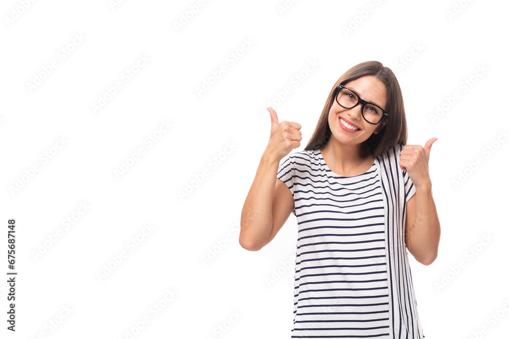 young european brunette woman in a striped sweater wears glasses for vision correction on a white background with copy space young european brunette woman in a striped sweater wears glasses for vision correction on a white background with copy space
