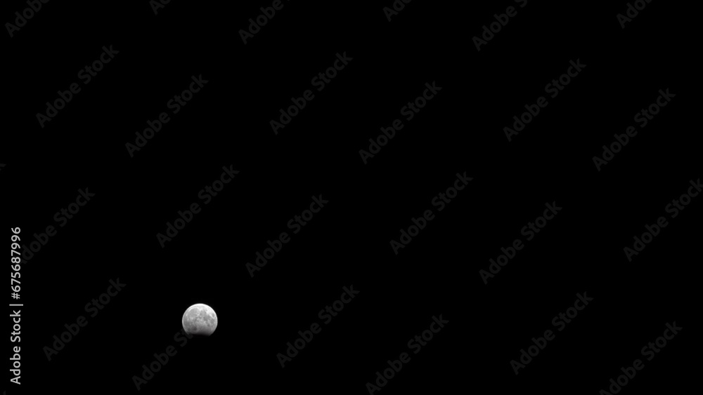 Lunar eclipse, October 2023, earth's shadow over moon bottom, moving through peak Lunar eclipse, October 2023, earth's shadow over moon bottom, moving through peak