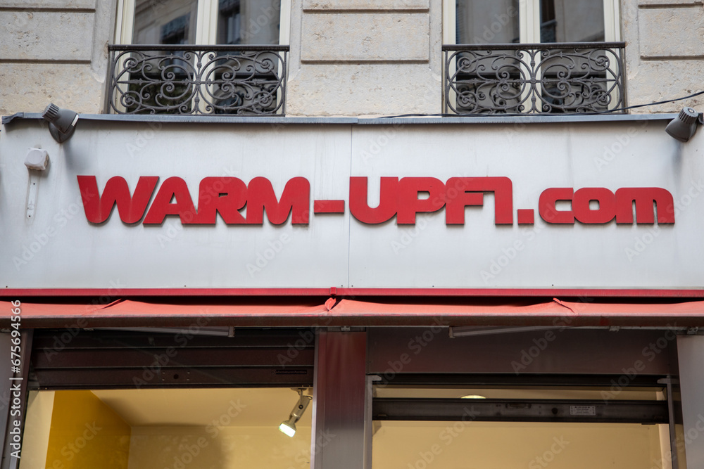 Warm Up F1 front fashion race car store with text logo and brand sign