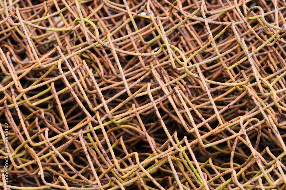 Rusty mesh in a roll close-up with square holes Rusty mesh in a roll close-up with square holes