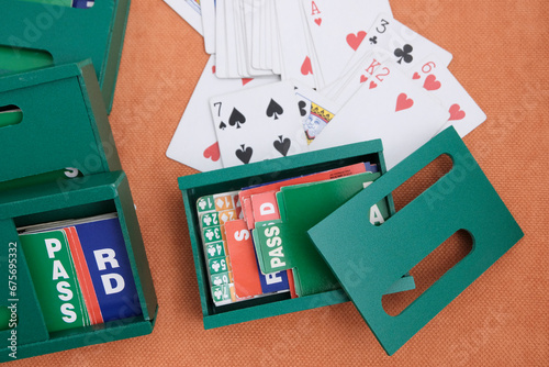 Playing cards and boxes for playing bridge. Gambling, bridge, poker concept. Sport equipment.