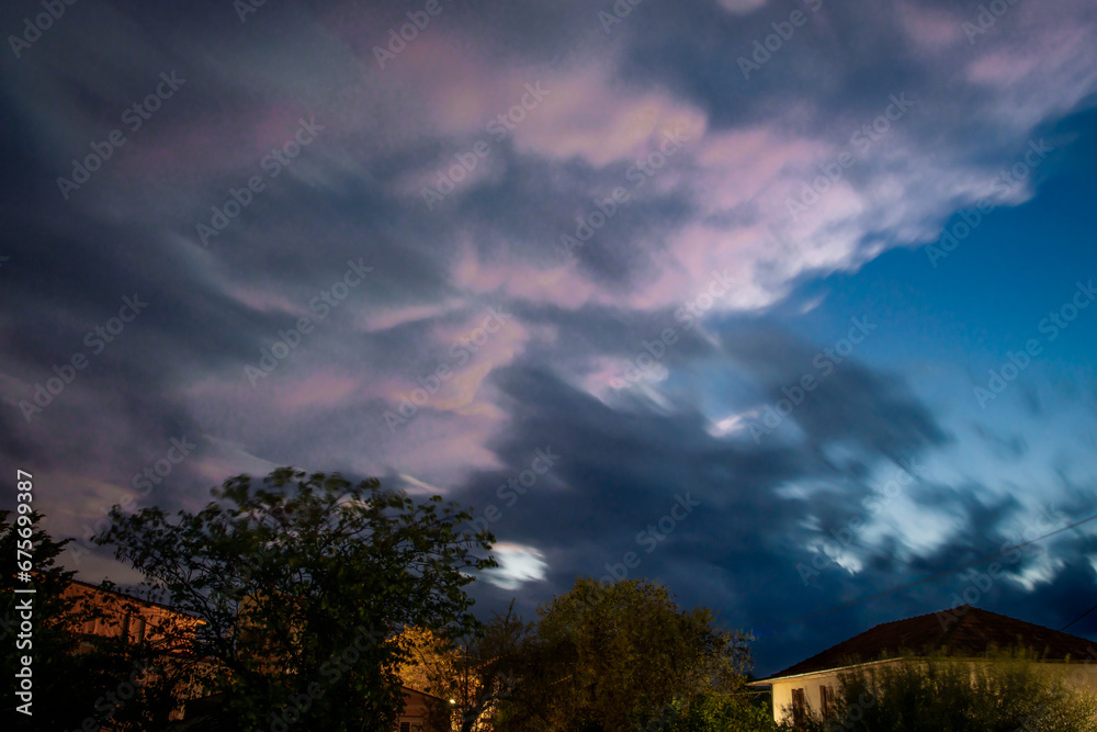 Long exposure of heavy storm clouds at night.