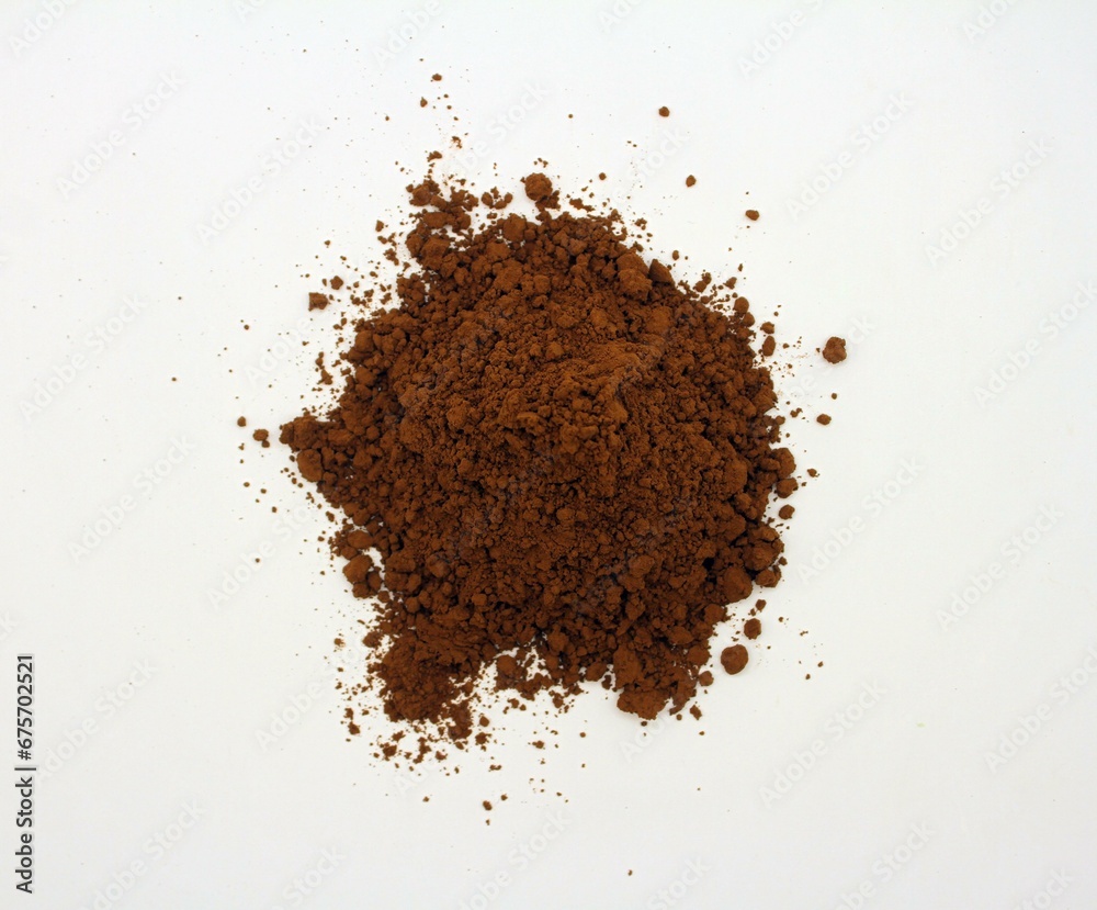Cocoa powder isolated on white background. Close-up. Cocoa powder isolated on white background. Close-up.