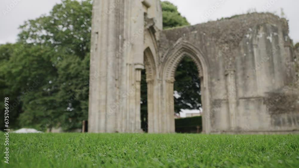 Glastonbury Abbey ruins central part, camera pan bottom to top 4k slow motion. Glastonbury Abbey ruins central part, camera pan bottom to top 4k slow motion.