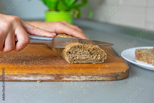 cut buckwheat bread on a cutting board in the kitchen