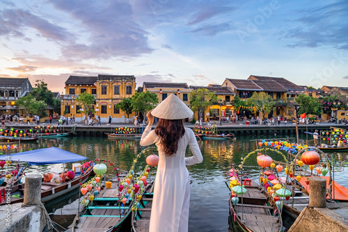 Asian woman wearing vietnam culture traditional at Hoi An ancient town, Vietnam. Hoi An is one of the most popular destinations in Vietnam  from Korea, Thailand, USA, Japan, China