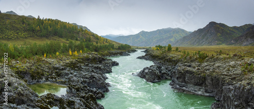 Panoramic scenic view of Katun river flowing amidst rocky coastlines against sky at Altai, Russia