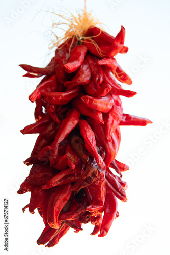 Red Chili Peppers hanging to dry at farmers market in Espanola New Mexico United States