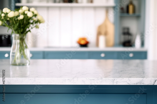 White marble countertop in modern blue kitchen interior with vase of flowers background. High quality photo