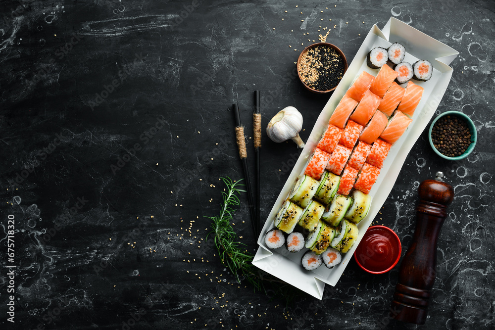 Japanese food. Set of sushi rolls with caviar, fish and shrimp. Food delivery. Free space for text. Japanese food. Set of sushi rolls with caviar, fish and shrimp. Food delivery. Free space for text.