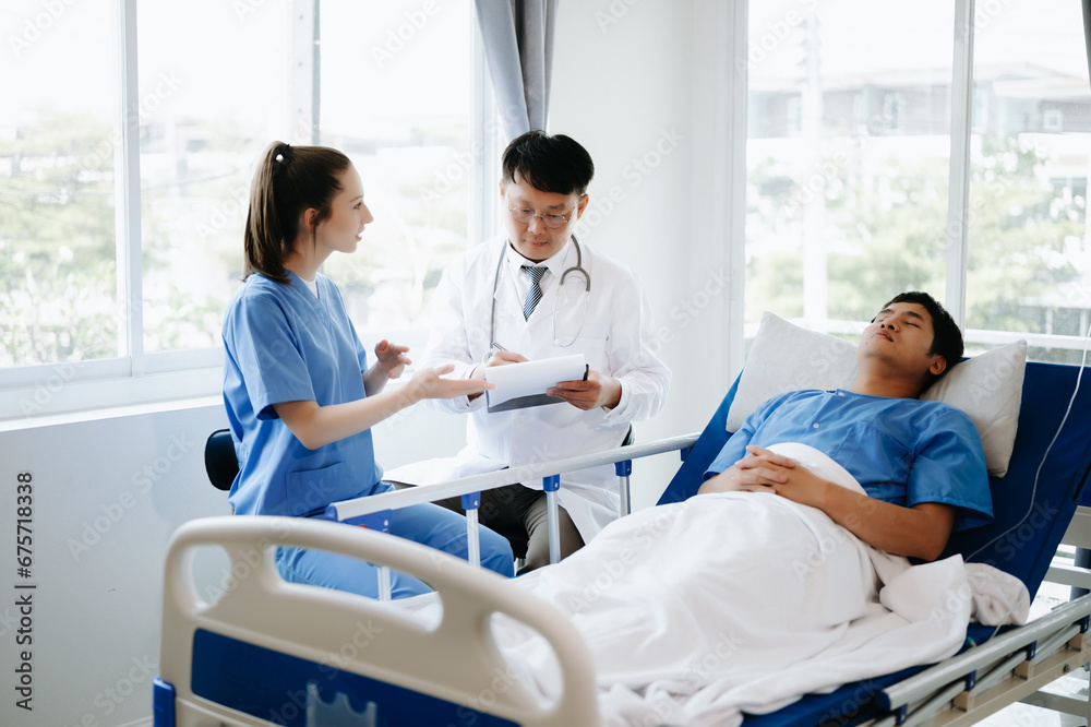 Doctors explaining the symptoms to a patient in hospital Doctors explaining the symptoms to a patient in hospital