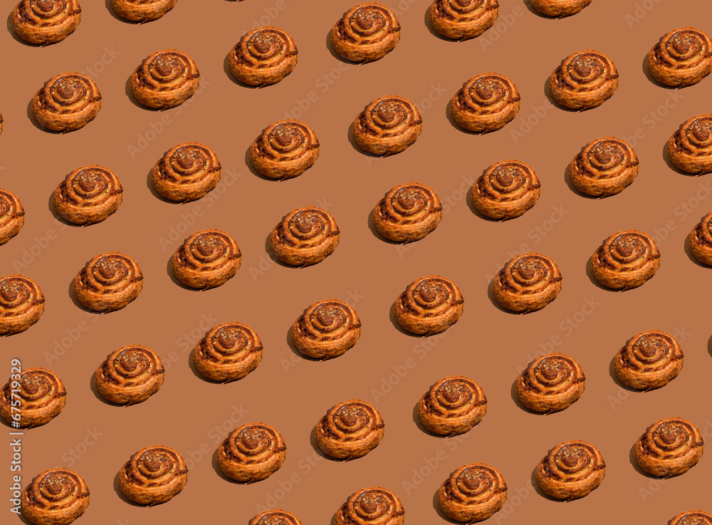 Cinnabon pattern on brown background Cinnabon pattern on brown background