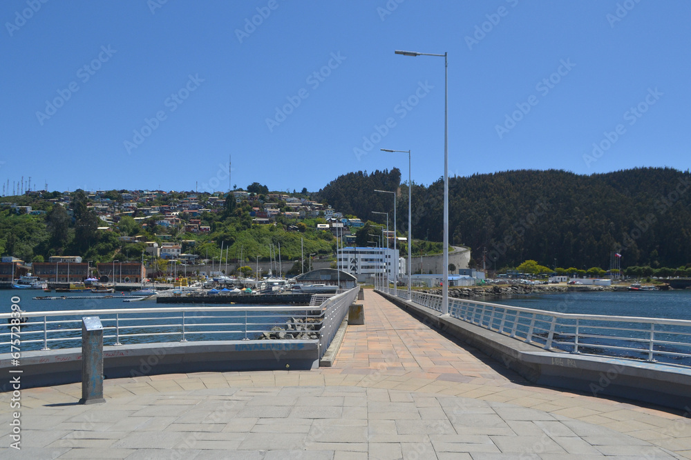 a promenade and a boardwalk in a port in southern Chile
