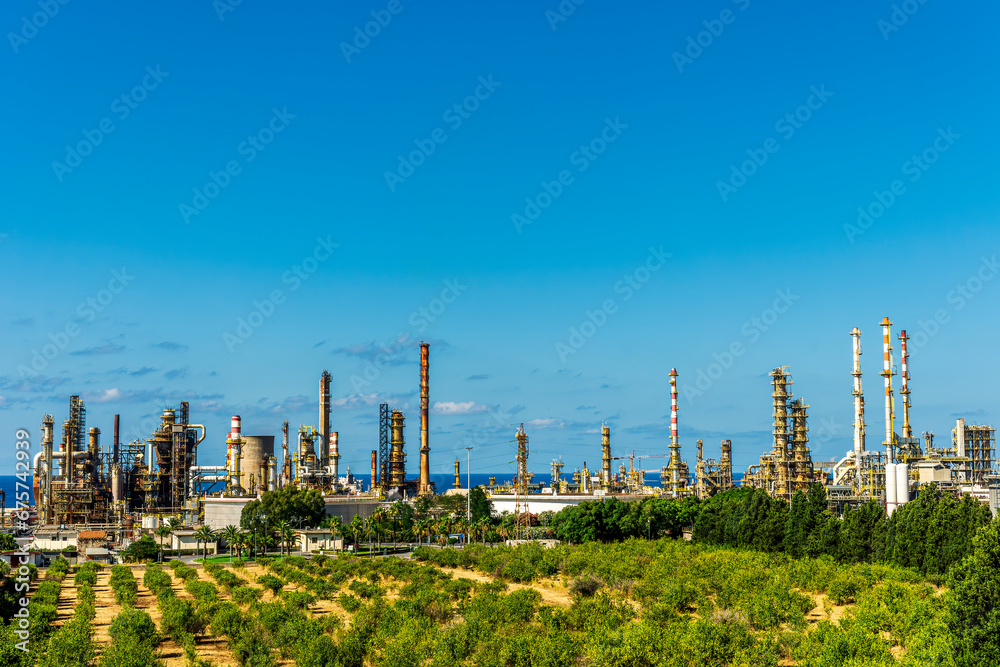 Obraz premium oil refinery facroty, recycle of oil and petroleum in green outdoor nature