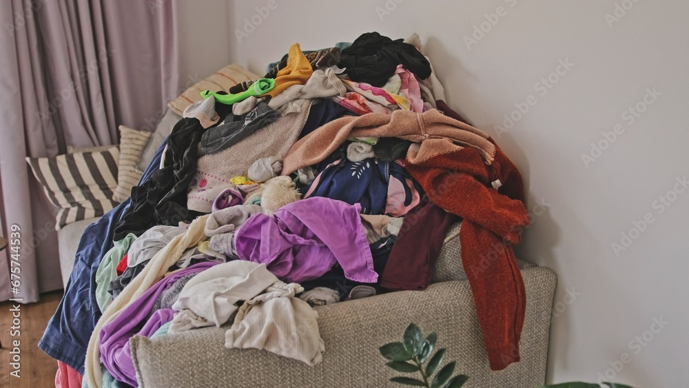 Heap of Dry Laundry Clothes before Ironing and Folding